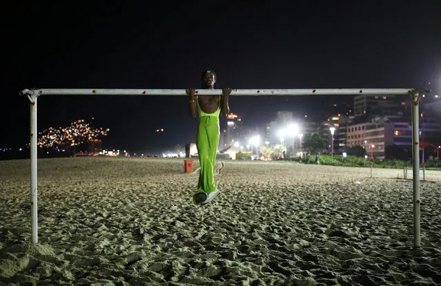 Daniel Oliveira, 21, poses on a goal before a mermaid competition at Ipanema beach in Rio de Janeiro, Brazil on August 14, 2016. (Photo by Nacho Doce/Reuters)
