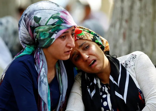Women mourn as they wait in front of a hospital morgue in the Turkish city of Gaziantep, after a suspected bomber targeted a wedding celebration in the city, Turkey, August 21, 2016. (Photo by Osman Orsal/Reuters)