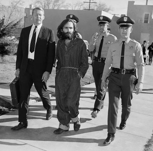 Charles Manson is taken to court in Independence, Calif., December 3, 1969. At left is his public defender, Fred Schaefer. (Photo by Harold Filan/AP Photo)
