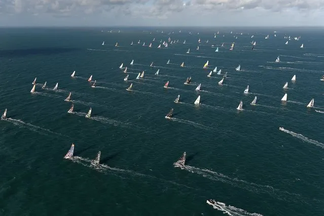 Skippers take the start of the Route du Rhum solo sailing race, off the coast of Saint-Malo, western France, on November 9, 2022. The Route du Rhum solo sailing race will start on November 9, 2022, from Saint-Malo to Pointe-a-Pitre in Guadeloupe. (Photo by Sebastien Salom-Gomis/AFP Photo)