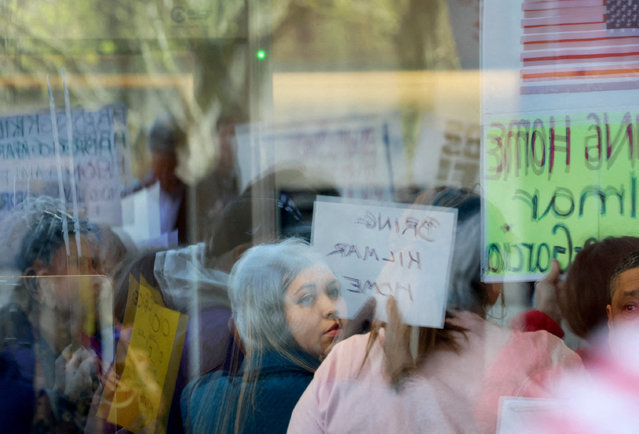 Jennifer Vasquez Sura, wife of Kilmar Abrego Garcia, is seen through reflection as she glances back while waiting in the security line to go inside of the U.S. District Court for a hearing in Kilmar Abrego Garcia’s case, the Salvadoran man who was deported without due process by U.S. President Donald Trump's administration to a prison in El Salvador, in Greenbelt, Maryland on April 15, 2025. (Photo by Leah Millis/Reuters)