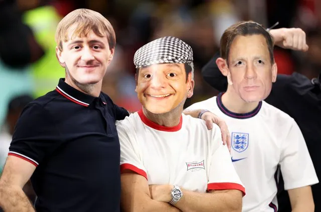England fans wearing face masks of Rodney, Del Boy and Daniel Craig look on prior to the FIFA World Cup Qatar 2022 Round of 16 match between England and Senegal at Al Bayt Stadium on December 04, 2022 in Al Khor, Qatar. (Photo by Clive Brunskill/Getty Images)