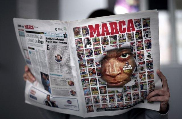 A picture taken in Madrid on February 20, 2024 shows a Spanish daily sport newspaper Marca's cover showing an image of Paris Saint-Germain's French forward Kylian Mbappe amid a combination of several Marca's covers. France captain Mbappe, 25, has told the French side he will leave at the end of the season, a source close to PSG told AFP on February 17. Superstar striker Mbappe is heavily linked with Madrid, who have tried to sign him multiple times in the past few years and may finally get their man. (Photo by Thomas Coex/AFP Photo)