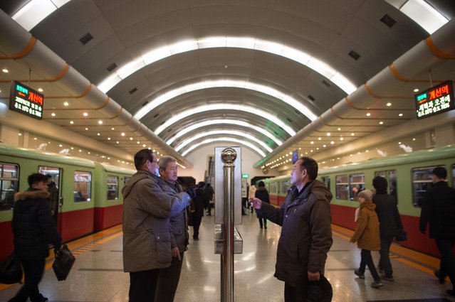 People read the Rodong Sinmun newspaper on a digital monitor displayed in the Kaeson Station of the Pyongyang Metro in Pyongyang on January 22, 2025. (Photo by KIM Won Jin/AFP Photo)