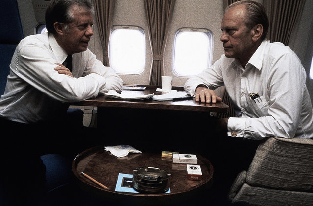 President Jimmy Carter with Gerald Ford aboard Air Force 1 between Cairo and Spain on October 10, 1981. (Photo by Dirck Halstead/AP Photo)