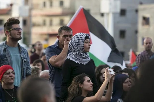 Israeli Arabs take part in a pro-Palestinian rally in the northern Israeli town of Sakhnin October 13, 2015. Leaders of Israel's Arab minority called for a commercial strike in their towns, one of which, Sakhnin, hosted a pro-Palestinian rally attended by thousands of people on Tuesday. (Photo by Baz Ratner/Reuters)