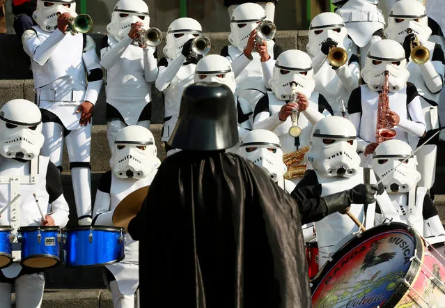 Members of Litoral school band from Caracollo wearing Star Wars costumes perform at San Francisco square in the center of La Paz, Bolivia, September 19, 2016. (Photo by David Mercado/Reuters)