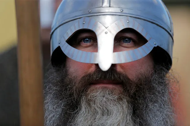 An actor portraying a member of medieval infantry waits to participate in a viking battle at the St Ives Medieval Fair in Sydney, one of the largest of its kind in Australia, September 24, 2016. (Photo by Jason Reed/Reuters)