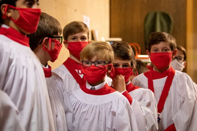 Choristers from the Choir of St John's College, Cambridge on October 22, 2020 as they prepare to sing evensong in St John's College Chapel, which fell silent for 207 days during the coronavirus lockdown. (Photo by Joe Giddens/PA Images via Getty Images)