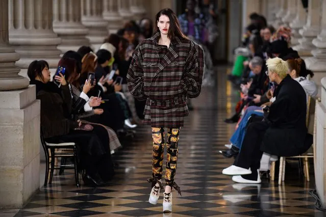 A model presents a creation from Vivienne Westwood Womenswear Fall-Winter 2023-2024 collection during Paris Fashion Week at the Hotel de la Marine, on Place de la Concorde in Paris, on March 4, 2023. (Photo by Julien de Rosa/AFP Photo)