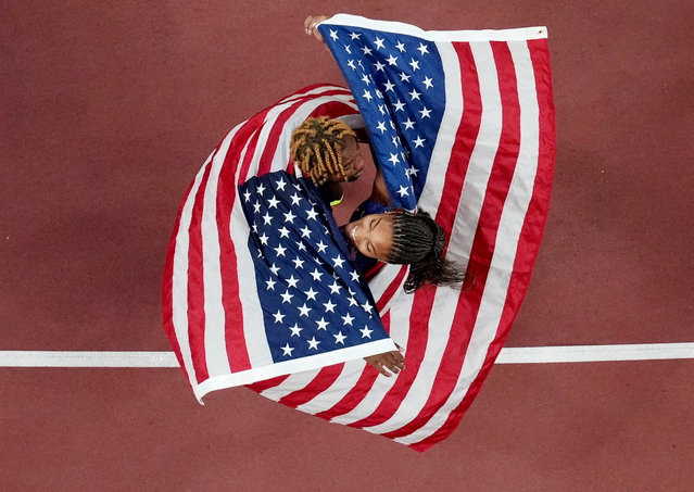 The US men’s 100 metres bronze medallist Noah Lyles celebrates with his team-mate Tara Davis-Woodhall, who won the gold in the women’s long jump at the World Athletics Championships in Tokyo on September 14, 2025. (Photo by Fabrizio Bensch/Reuters)