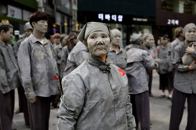 South Koreans perform to commemorate the 70th anniversary of Jeju Uprising on April 3, 2018 in Seoul, South Korea. Approximately 300 people participated in the performance to pay respect to the victims of Jeju Uprising, the clash between South Korean government under the control of United Nation Temporary Commission on Korea and the guerrilla fighters of South Korean Labor Party which was ruling the Jeju Island in 1948, which is said to have killed tens of thousand of people. (Photo by Chung Sung-Jun/Getty Images)