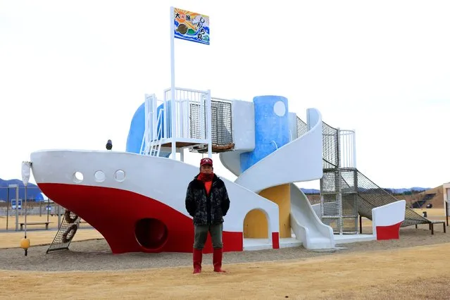 Fisherman Haruo Ono, 71, poses for a photo at a park built where his village was before it was damaged by the March 2011 tsunami, in Shinchimachi, about 55 km away from the disabled Fukushima Dai-ichi nuclear power plant, in Fukushima Prefecture, Japan, March 2, 2023. The tsunami moved Haruo into high inland, surrounded by other new houses on straight roads laid out after the disaster. “In the tsunami I lost my house, I lost all my possessions, I lost my younger brother. Then we had the nuclear accident”, he said. (Photo by Kim Kyung-Hoon/Reuters)