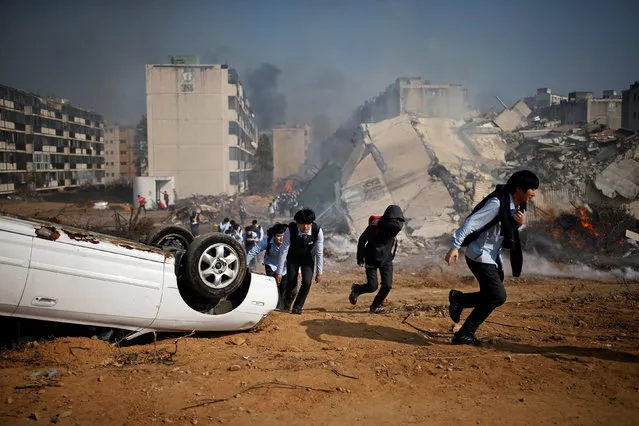 High school students take part in a large-scale earthquake simulation exercise in Seoul, South Korea October 19, 2016. (Photo by Kim Hong-Ji/Reuters)