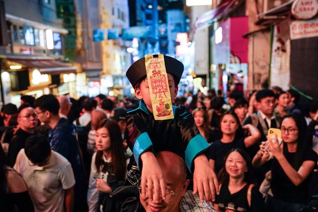 A boy dresses as a Chinese ghost in Lan Kwai Fong, a popular bar district, to celebrate Halloween in Hong Kong, China on October 31, 2025. (Photo by Vernon Yuen/Nexpher via ZUMA Press Wire/Rex Features/Shutterstock)