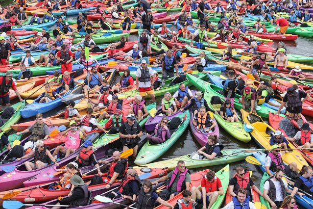 Participants in Poland's largest canoeing trip on the Pilica River prepare in Sulejow, central Poland, 25 July 2024. The Pilica Trail is one of the country's most popular canoe routes on lowland rivers. (Photo by Marian Zubrzycki/EPA/EFE)