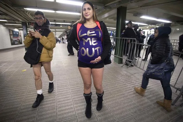 A pregnant woman takes part in the “No Pants Subway Ride” in the Manhattan borough of New York January 11, 2015. (Photo by Carlo Allegri/Reuters)