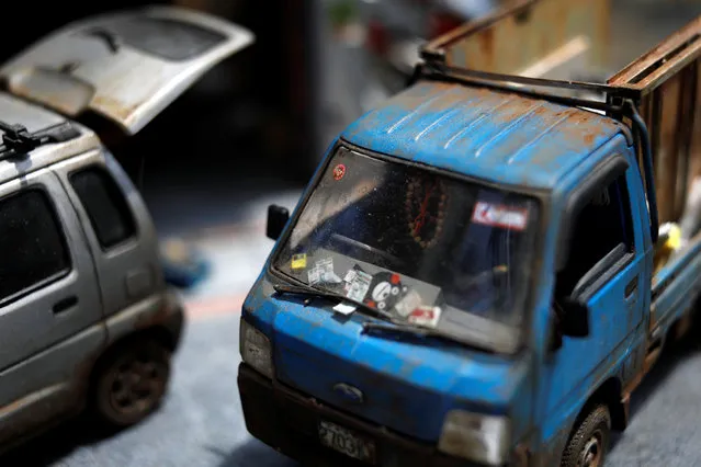 A miniature model of street scenes created by Taiwanese artist Hank Cheng is seen at his workshop in New Taipei City, Taiwan on June 17, 2018. Cheng sometimes spends up to twelve hours a day on his art and says that although the minute detail work can be excruciatingly boring, it is always worth it in the end. (Photo by Tyrone Siu/Reuters)