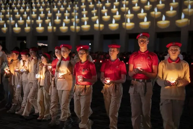 Members of Russia's Young Army Cadets National Movement hold candles marking the 82nd anniversary of the German invasion of the Soviet Union at the World War II Museum on Poklonnaya Hill in Moscow, Russia, early Thursday, June 22, 2023. (Photo by Alexander Zemlianichenko/AP Photo)