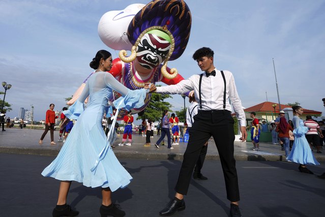 Cambodian dancers perform during the “Celebrating Cambodia” event as part of the New Year's Eve in front of Royal Palace in Phnom Penh, Cambodia, Tuesday December 31, 2024. (Photo by Heng Sinith/AP Photo)
