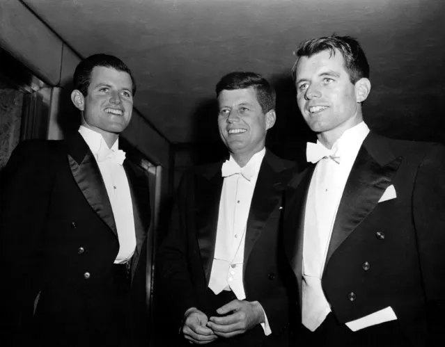 Sen. John F. Kennedy, center, D-Mass., and his brothers Edward Kennedy, left, a student at the University of Virginia, and Robert F. Kennedy, chief counsel to the Senate Rackets Committee, attend the annual Gridiron Club dinner in Washington, D.C., on March 15, 1958. (Photo by AP Photo)