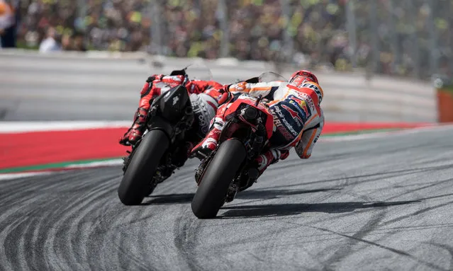 Spanish rider Jorge Lorenzo of team Ducati leads ahead of Spanish rider Marc Marquez of team Repsol Honda in the Motorcycling Grand Prix of Austria at Red Bull Ring in Spielberg, Austria, 12 August 2018. (Photo by Andreas Schaad/EPA/EFE)