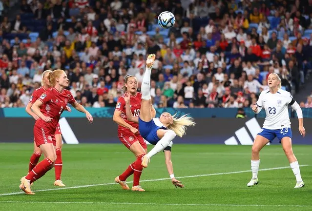 England's forward #18 Chloe Kelly attempts an overhead kick during the Australia and New Zealand 2023 Women's World Cup Group D football match between England and Denmark at Sydney Football Stadium in Sydney on July 28, 2023. (Photo by Carl Recine/Reuters)