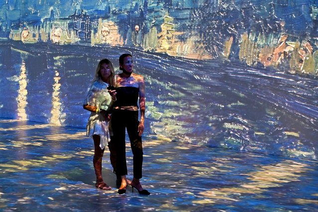 People attend the Beyond Van Gogh exhibit. Beyond Van Gogh is a rich and unique multimedia experience, taking the viewer on a journey through over 300 iconic artworks held at the Ice Palace, Miami on April 13, 2021. (Photo by Larry Marano/Rex Features/Shutterstock)