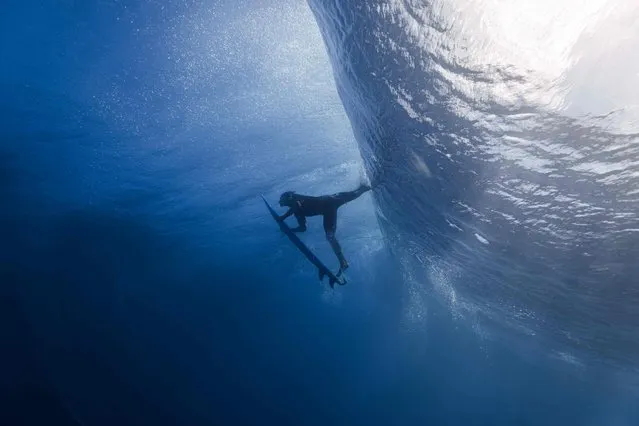 This underwater picture shows Brazilian surfer Gabriel Medina during a training session on August 9, 2023 in Teahupo'o, Tahiti, French Polynesia, a few days before the WSL Shiseido Tahiti pro surfing event. (Photo by Ben Thouard/AFP Photo)