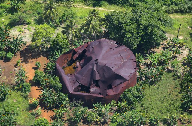 In this aerial image, debris of the Japanese Imperial Army fuel tank is seen on August 30, 2016 in Tonowas Island, Micronesia. (Photo by The Asahi Shimbun via Getty Images)