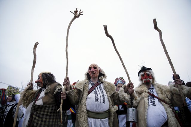 Local residents dressed in costumes perform during celebrations for the Malanka holiday in the village of Krasnoilsk in the Chernivtsi region of Ukraine, January 14, 2016. (Photo by Valentyn Ogirenko/Reuters)