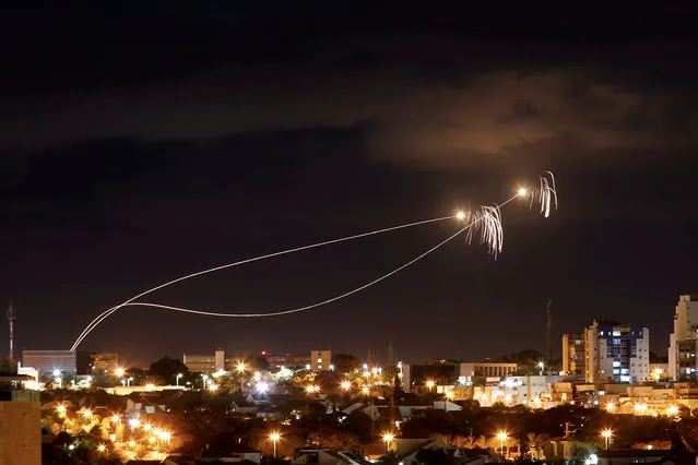 Iron Dome anti-missile system fires interception missiles as rockets are launched from Gaza towards Israel as seen from the city of Ashkelon, Israel October 27, 201. (Photo by Amir Cohen/Reuters)