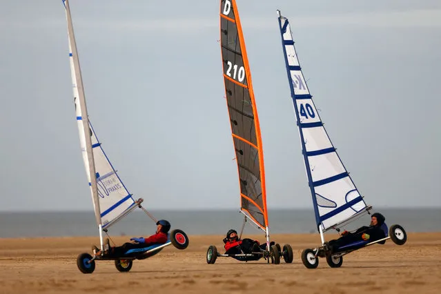 Pilots race on the beach during the miniyacht European Championships in Lytham St Annes, Lancashire, Britain on October 23, 2023. (Photo by Lee Smith/Reuters)