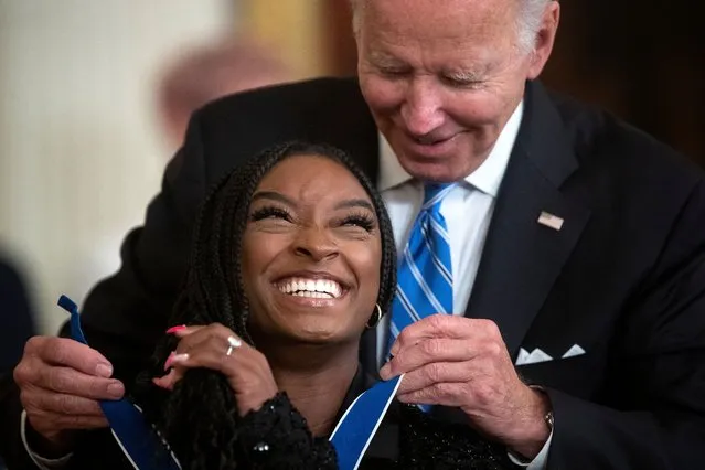 President Joe Biden presents the Presidential Medal of Freedom to Olympic gymnast Simone Biles, during a medal ceremony inside the East Room at the White House in Washington, D.C., on Thursday, July 7, 2022. (Photo by Tom Brenner/The Washington Post)