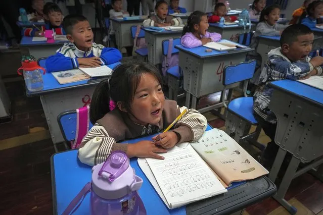 Tibetan students learn Tibetan writing in a first-grade class at the Shangri-La Key Boarding School during a media-organized tour in Dabpa county, Kardze Prefecture, Sichuan province, China on September 5, 2023. (Photo by Andy Wong/AP Photo)