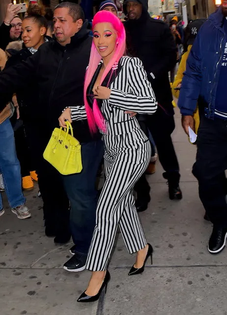 Cardi B was spotted out set of her new Netflix series, Rhythm and Flow in NYC on Wednesday, January 9, 2019. She was joined by Bronx Rappers, Fat Joe, and Jadakiss, who were also judges on the show with her, as they hunt for the next big Hip Hop talent. Cardi wore Highlighter pink hair, and a Beetlejuice inspired Black and White pinstripe Pantsuit as she left her Trailer. (Photo by 247PAPS.TV/Splash News and Pictures)