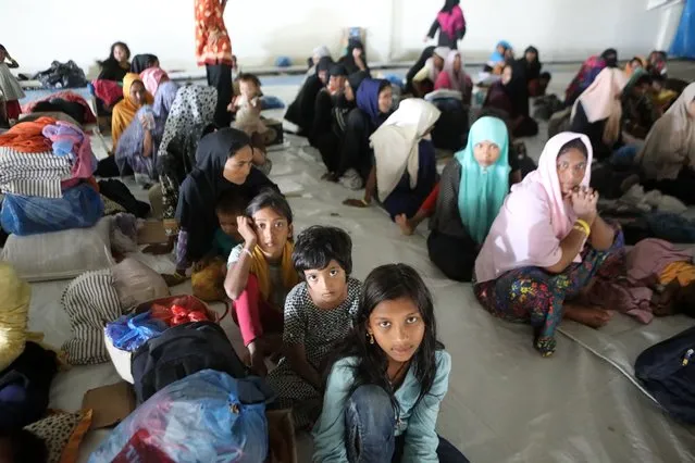 Rohingya refugees rest at their temporary shelter in a government building basement during migrant day in Banda Aceh, Indonesia on 18 December 2023. International migrant day is celebrated to raise awareness about migrant issues around the world as the effect of climate change, conflict and insecurity has forced people to move within countries or across borders, according to The UN Migration Agency (IOM). (Photo by Hotli Simanjuntak/EPA/EFE)