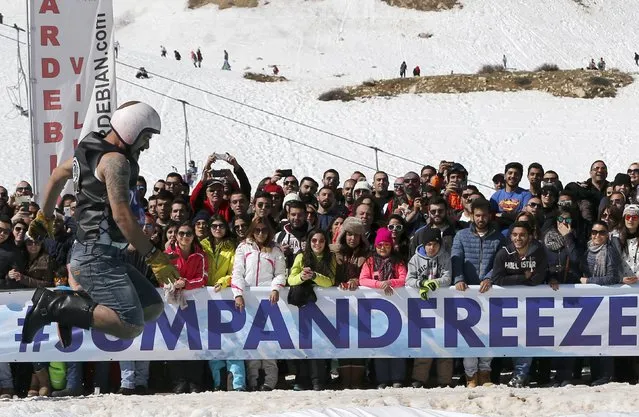 A man participates in the Red Bull Jump & Freeze Lebanon at Mzaar Kfardebian Ski Resort in mount Lebanon February 28, 2016. (Photo by Jamal Saidi/Reuters)