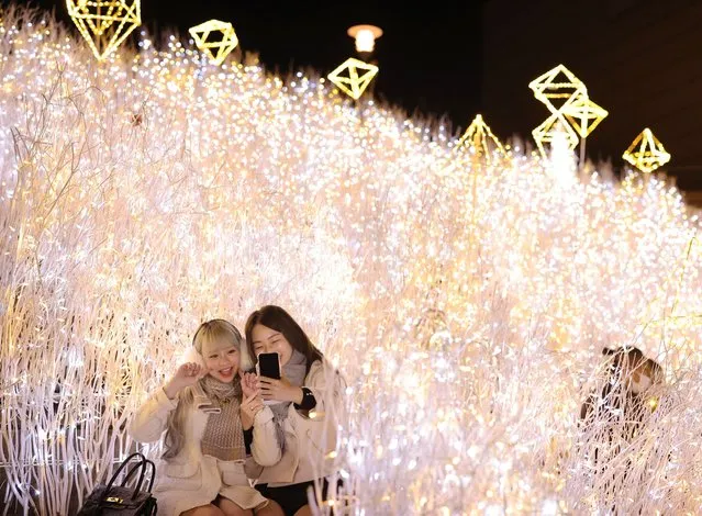 An illumination is held at a commercial facility “NAMBA PARKS” in Osaka City, Osaka Prefecture on November 15, 2022. Approximately 650,000 LED (light-emitting diode) bulbs are decorated to imagine waterfalls and meadows at the event. (Photo by Naoya Azuma/Yomiuri/The Yomiuri Shimbun via AFP Photo)