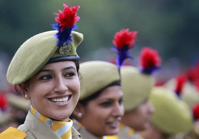 A member of the women's police contingent smiles at a parade during India's Independence Day celebrations in Srinagar August 15, 2012. (Photo by Fayaz Kabli/Reuters)