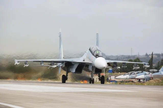 A Russian Sukhoi Su-30 fighter jet is seen on a runway shortly before taking off, part of the withdrawal of Russian troops from Syria, at Hmeymim airbase, Syria, March 16, 2016. (Photo by Vadim Grishankin/Reuters/Russian Ministry of Defence)