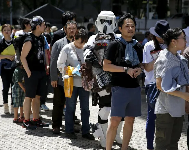 A cosplayer dressed up as Star Wars character Scout Trooper joins a line to attend a Star Wars Day fan event in Tokyo May 4, 2015. (Photo by Toru Hanai/Reuters)