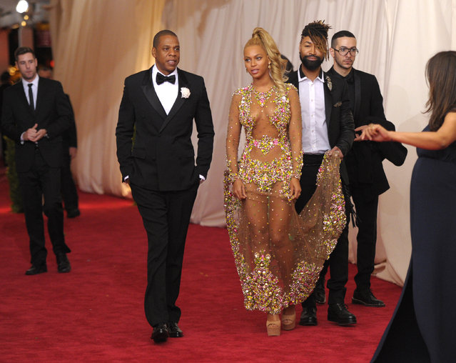 Jay-Z, left, and Beyonce arrive at The Metropolitan Museum of Art's Costume Institute benefit gala celebrating “China: Through the Looking Glass” on Monday, May 4, 2015, in New York. (Photo by Evan Agostini/Invision/AP Photo)