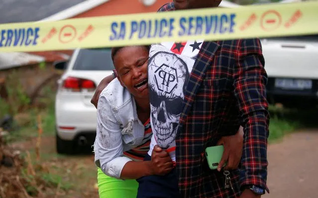 A woman reacts after identifying the body of a family member killed during a police raid on suspected criminals in Marianhill near Durban, South Africa on April 3, 2024. (Photo by Rogan Ward/Reuters)