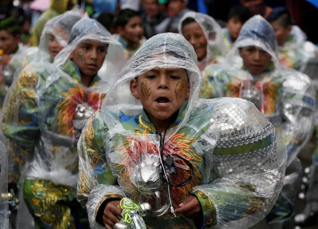 Members of Caporales children group perform during the carnival parade in Oruro, Bolivia February 25, 2017. (Photo by David Mercado/Reuters)