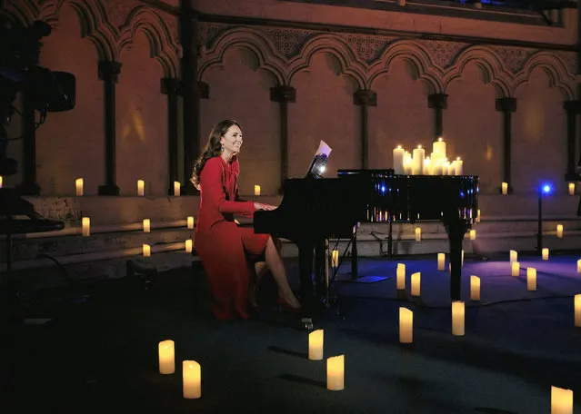 Britain's Kate, Duchess of Cambridge, performs at a Christmas carol concert at Westminster Abbey in London. Scottish singer Tom Walker praised the piano skills of the Duchess of Cambridge after the pair recorded a Christmas tune shown during a carol concert on Christmas Eve. Walker, 30, performed a new song, “For Those Who Can’t Be Here”,’ accompanied by Kate playing the piano, in a pre-recorded segment shown during the concert broadcast on ITV on Friday. Walker said he had kept the performance a secret, even from his mother. (Photo by Alex Bramall via AP Photo)