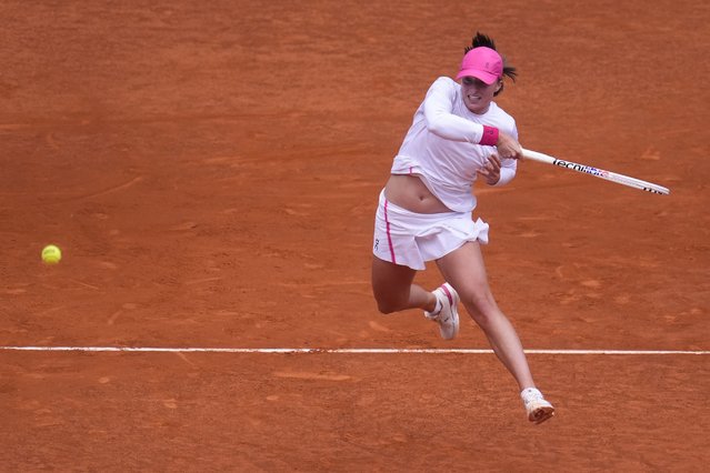 Iga Swiatek of Poland returns the ball to Madison Keys of USA during the Mutua Madrid Open tennis tournament in Madrid, Spain, Thursday, May 2, 2024. (Photo by Manu Fernandez/AP Photo)