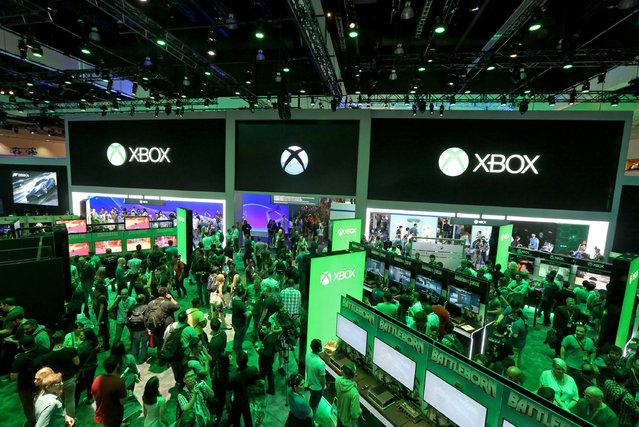 E3 2015 attendees interact with newly announced games and experiences at the Xbox booth at E3 in Los Angeles on Tuesday, June 16, 2015. (Photo by Casey Rodgers/Invision for Microsoft/AP Images)