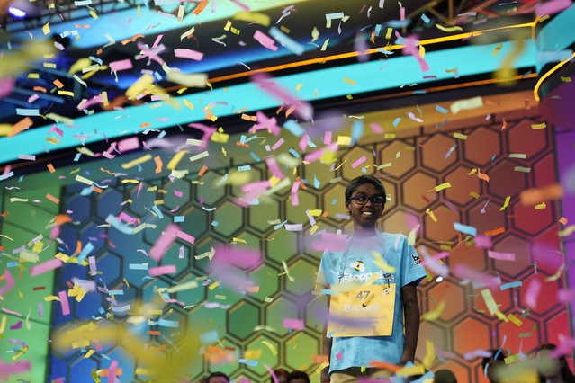 Bruhat Soma, 12, of Tampa, Fla., stands amid confetti after winning the Scripps National Spelling Bee, in Oxon Hill, Md., Thursday, May 30, 2024. (Photo by Nathan Howard/AP Photo)
