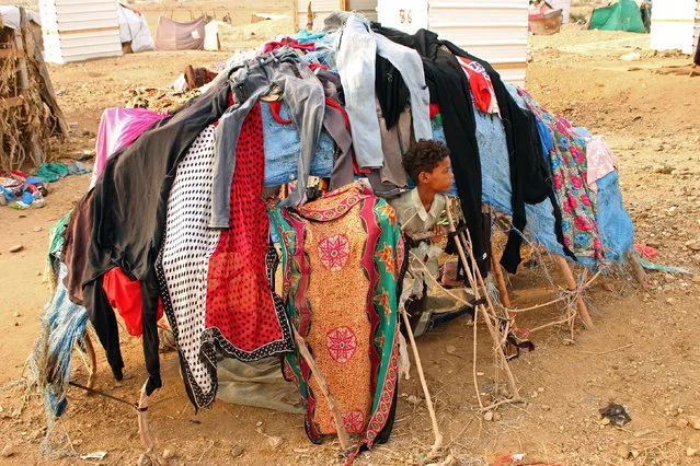 A displaced Yemeni child who fled the fightings is pictured at a makeshift camp in the district of Abs, in Yemen's northwestern Hajjah province on June 10, 2019. Saudi air defence forces on June 10 intercepted two drones launched by Huthi rebels from neighbouring Yemen, state media reported, as the Iran-aligned militia steps up attacks on the kingdom. The drones targeted Khamis Mushait in the kingdom's south and caused no damage or casualties, the Saudi-led coalition fighting in Yemen said in a brief statement released early Tuesday by the official Saudi Press Agency (SPA). (Photo by Essa Ahmed/AFP Photo)